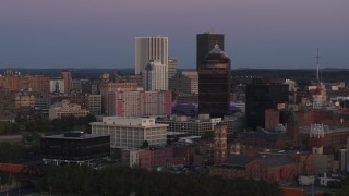 DX0002_210_002 - 5.7K aerial stock footage of passing by First Federal Plaza and office buildings at twilight, Downtown Rochester, New York