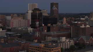 DX0002_210_005 - 5.7K aerial stock footage of First Federal Plaza, Legacy Tower and radio tower at twilight, Downtown Rochester, New York