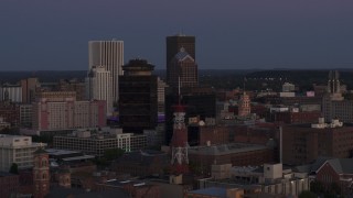DX0002_210_006 - 5.7K aerial stock footage of First Federal Plaza, radio tower, and Legacy Tower at twilight, Downtown Rochester, New York