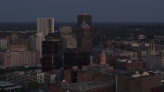 DX0002_210_007 - 5.7K aerial stock footage focus on Legacy Tower at twilight during orbit of skyline, Downtown Rochester, New York