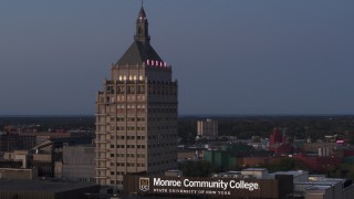 DX0002_210_011 - 5.7K aerial stock footage fly away from Kodak Tower at twilight and descend, Rochester, New York