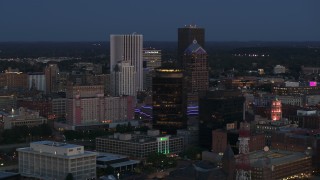 DX0002_210_016 - 5.7K aerial stock footage of the city skyline behind First Federal Plaza at twilight, Downtown Rochester, New York