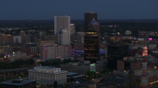 DX0002_210_017 - 5.7K aerial stock footage orbit the city skyline behind First Federal Plaza at twilight, Downtown Rochester, New York