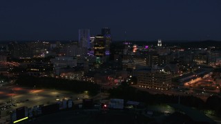 DX0002_210_024 - 5.7K aerial stock footage of a reverse view of the city's skyline at night, Downtown Rochester, New York