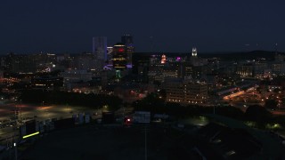 DX0002_210_025 - 5.7K aerial stock footage of a wide orbit of the city's skyline at night, Downtown Rochester, New York