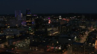 DX0002_210_029 - 5.7K aerial stock footage of orbiting downtown office buildings at night, Downtown Rochester, New York