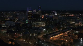 DX0002_210_034 - 5.7K aerial stock footage a view of office buildings and skyline during descent at night, Downtown Rochester, New York