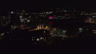 DX0002_210_060 - 5.7K aerial stock footage of an orbit of a brewery at night, Rochester, New York
