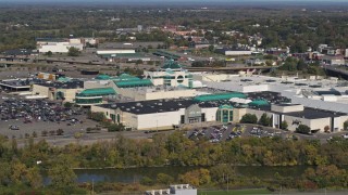 DX0002_211_028 - 5.7K aerial stock footage of orbiting a shopping mall in Syracuse, New York