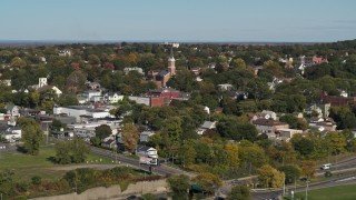 DX0002_212_014 - 5.7K aerial stock footage of approaching the St John the Baptist church steeple in Syracuse, New York