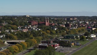 DX0002_212_017 - 5.7K aerial stock footage of descending past Assumption Church in Syracuse, New York
