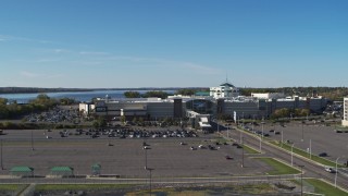 DX0002_212_022 - 5.7K aerial stock footage of the Destiny USA shopping mall while descending by parking lot, Syracuse, New York