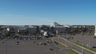 DX0002_212_023 - 5.7K aerial stock footage fly over parking lot toward the Destiny USA shopping mall, Syracuse, New York