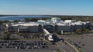 DX0002_212_026 - 5.7K aerial stock footage flying over parking lots to approach the Destiny USA shopping mall, Syracuse, New York