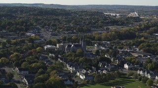 DX0002_213_003 - 5.7K aerial stock footage of flying by church and a neighborhood in Syracuse, New York