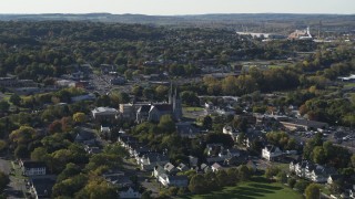 DX0002_213_005 - 5.7K aerial stock footage of passing by church and a neighborhood in Syracuse, New York