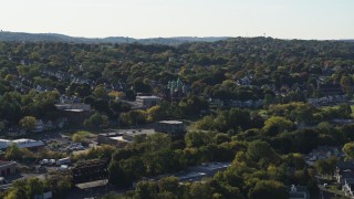 DX0002_213_007 - 5.7K aerial stock footage orbit a Catholic church and a neighborhood in Syracuse, New York