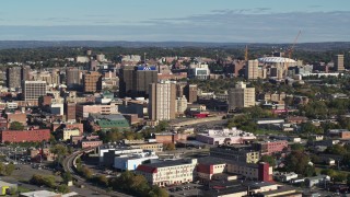DX0002_213_010 - 5.7K aerial stock footage of slowly passing by office buildings in Downtown Syracuse, New York