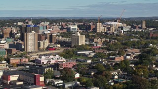 DX0002_213_011 - 5.7K aerial stock footage of office buildings near Carrier Dome stadium in Downtown Syracuse, New York