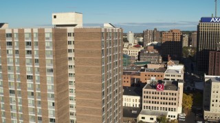 DX0002_213_019 - 5.7K aerial stock footage flyby downtown and reveal apartment building, Downtown Syracuse, New York