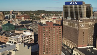 DX0002_213_021 - 5.7K aerial stock footage of flying by hotel and office buildings, Downtown Syracuse, New York