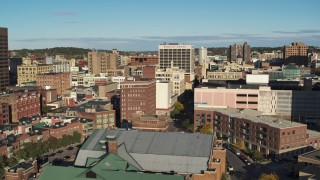 DX0002_213_023 - 5.7K aerial stock footage of descending past office buildings, Downtown Syracuse, New York