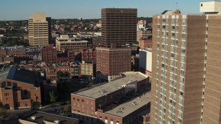 DX0002_213_028 - 5.7K aerial stock footage of flying by apartment high-rise to reveal Chase Towers, Downtown Syracuse, New York