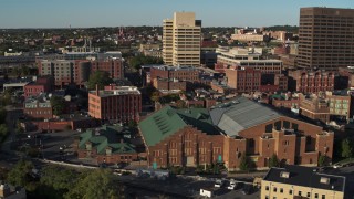 DX0002_213_033 - 5.7K aerial stock footage of orbiting the Museum of Science & Technology and office buildings, Downtown Syracuse, New York