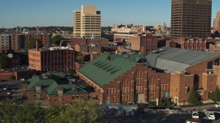 DX0002_213_038 - 5.7K aerial stock footage of descending by the the Museum of Science & Technology, Downtown Syracuse, New York