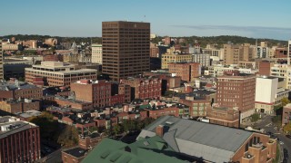 DX0002_213_041 - 5.7K aerial stock footage of circling the Chase Tower office high-rise, reveal apartment building, Downtown Syracuse, New York
