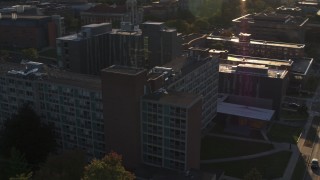 DX0002_214_010 - 5.7K aerial stock footage of circling Dellplain Hall at Syracuse University at sunset, New York