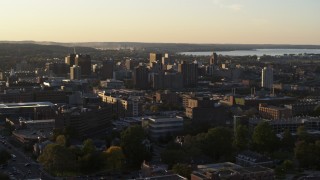DX0002_214_015 - 5.7K aerial stock footage of downtown seen from Syracuse University at sunset, New York