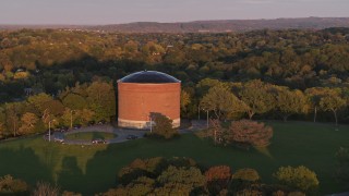 DX0002_214_029 - 5.7K aerial stock footage of the Stewart Stand Pipe at Thornden Park, Syracuse at sunset, New York