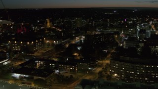 DX0002_215_013 - 5.7K aerial stock footage of orbiting Syracuse University campus at twilight, Syracuse, New York