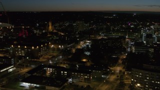 DX0002_215_014 - 5.7K aerial stock footage orbit Syracuse University campus buildings at twilight, Syracuse, New York