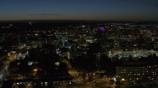 DX0002_215_016 - 5.7K aerial stock footage a view across Syracuse University at twilight to Downtown Syracuse, New York
