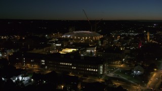 DX0002_215_018 - 5.7K aerial stock footage of Carrier Dome and Syracuse University at twilight, Syracuse, New York