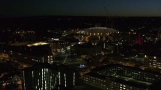 DX0002_215_020 - 5.7K aerial stock footage of circling Carrier Dome and Syracuse University at twilight, Syracuse, New York