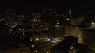 DX0002_215_039 - 5.7K aerial stock footage orbit One Lincoln Center and reveal apartment building at night, Downtown Syracuse, New York