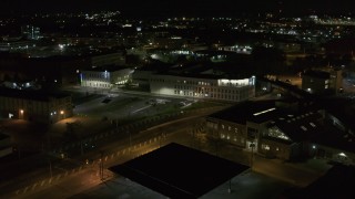 DX0002_215_044 - 5.7K aerial stock footage of approaching an office building at night, Downtown Syracuse, New York