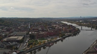 DX0002_216_006 - 5.7K aerial stock footage of flying away from the downtown area of Troy, New York by the Hudson River