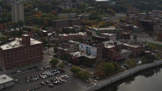 DX0002_216_007 - 5.7K aerial stock footage of orbiting brick offices and shops in the downtown area of Troy, New York