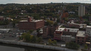 DX0002_216_008 - 5.7K aerial stock footage orbit and approach brick offices and shops in the downtown area of Troy, New York