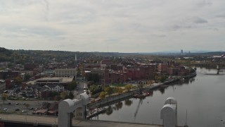 DX0002_216_009 - 5.7K aerial stock footage wide view of the downtown area of Troy, New York, descend and reveal bridge