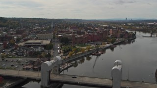DX0002_216_010 - 5.7K aerial stock footage ascend from bridge for wide view of the downtown area of Troy, New York