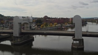 DX0002_216_012 - 5.7K aerial stock footage fly over bridge and river toward the downtown area of Troy, New York