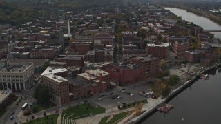 DX0002_216_015 - 5.7K aerial stock footage orbit brick buildings the downtown area of Troy, New York, reveal riverfront park