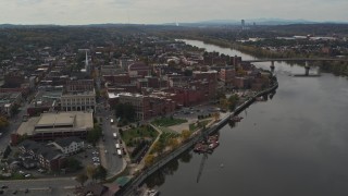 DX0002_216_016 - 5.7K aerial stock footage reverse view of the downtown area of Troy, New York, and riverfront park