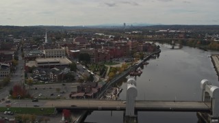 DX0002_216_017 - 5.7K aerial stock footage reverse view of the downtown area of Troy, New York, and riverfront park