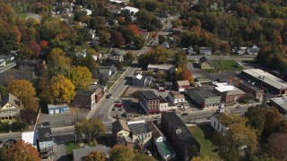 DX0002_216_018 - 5.7K aerial stock footage of flying away from a small town intersection in Fort Edward, New York